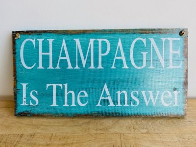 champagne is the answer wall sign